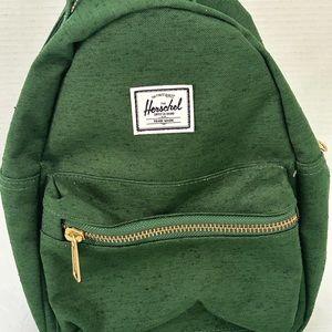 Herschel Nova Mini Backpack. Exterior: Green Interior: red/white stripped